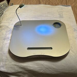 Bed table with light and cup holder, great for reading a book in bed!